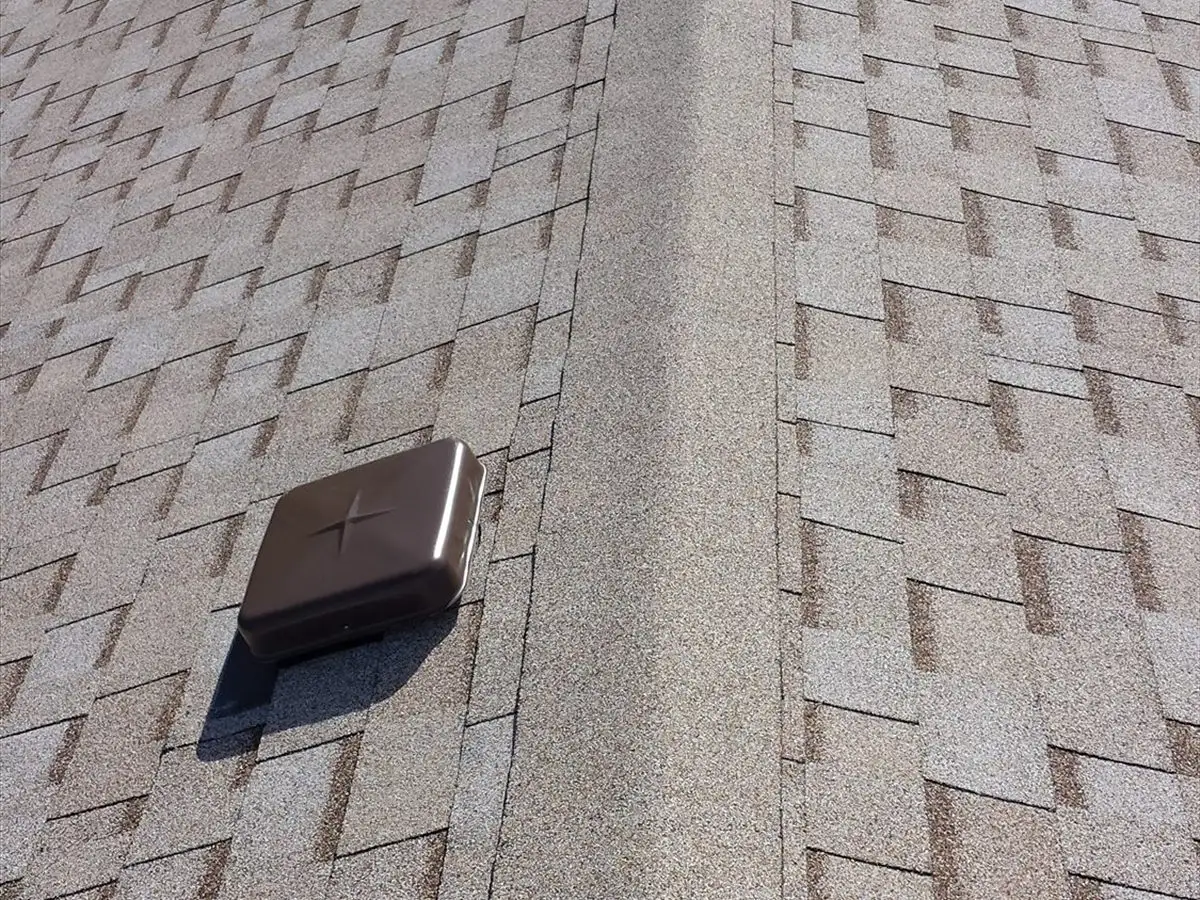 Ridge cap and box vents on a new Owens Corning roof