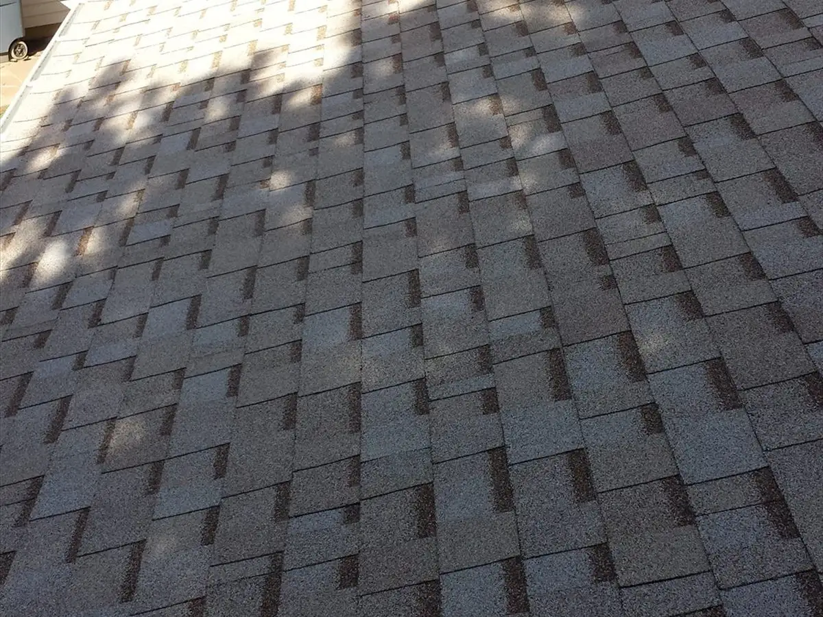 New Owens Corning shingles where the roof meets a sided wall