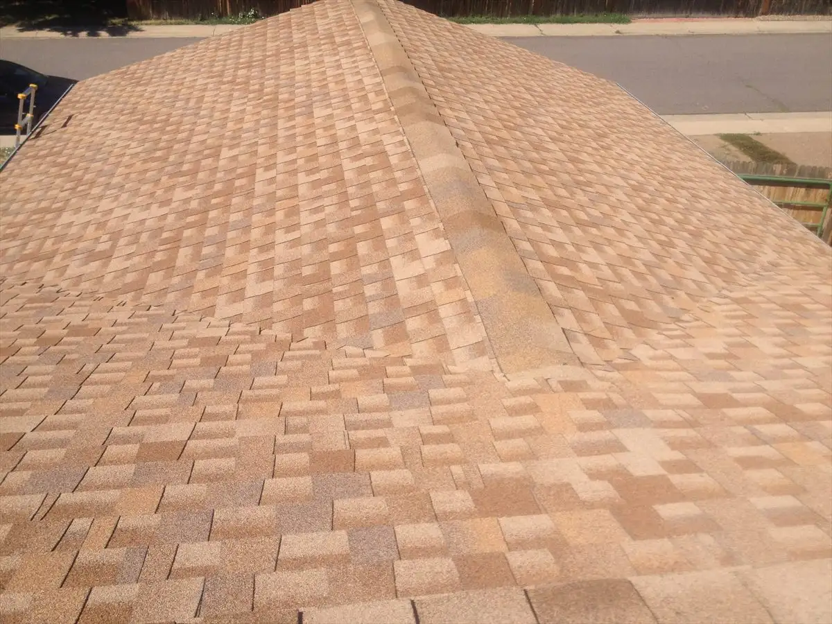Tan Owens Corning shingle roof with ridge cap