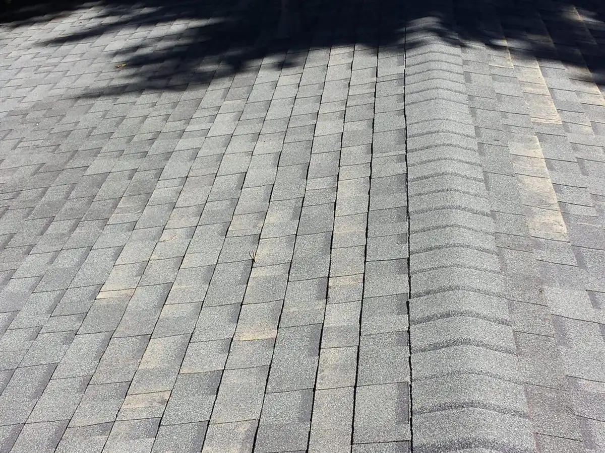 Completed shingle roof running up to the ridge