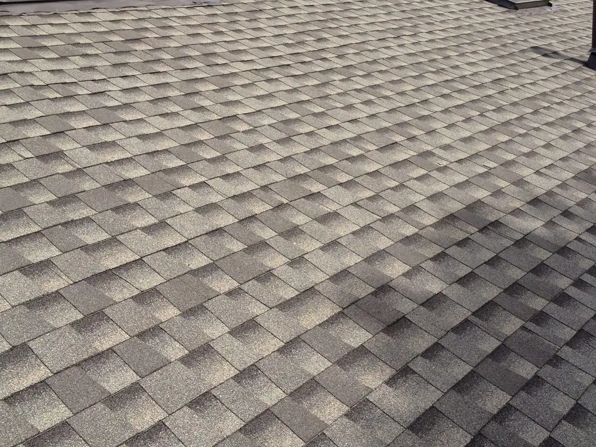 New roof around a brick chimney and a skylight